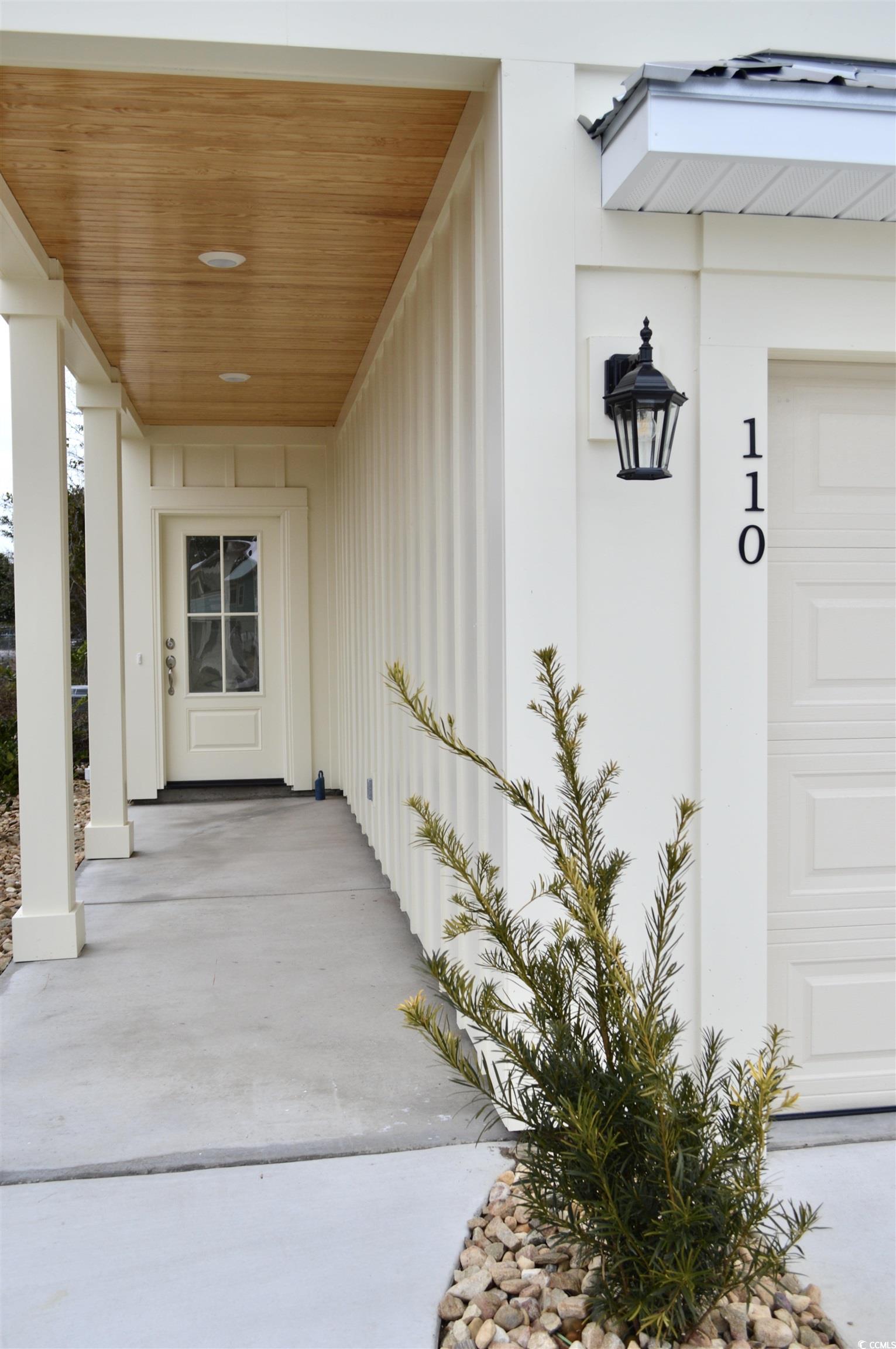 110 Hallandale Lane, Unit LEFT Murrells Inlet, SC 29576 - Photo 4 of 27 Property entrance with a garage