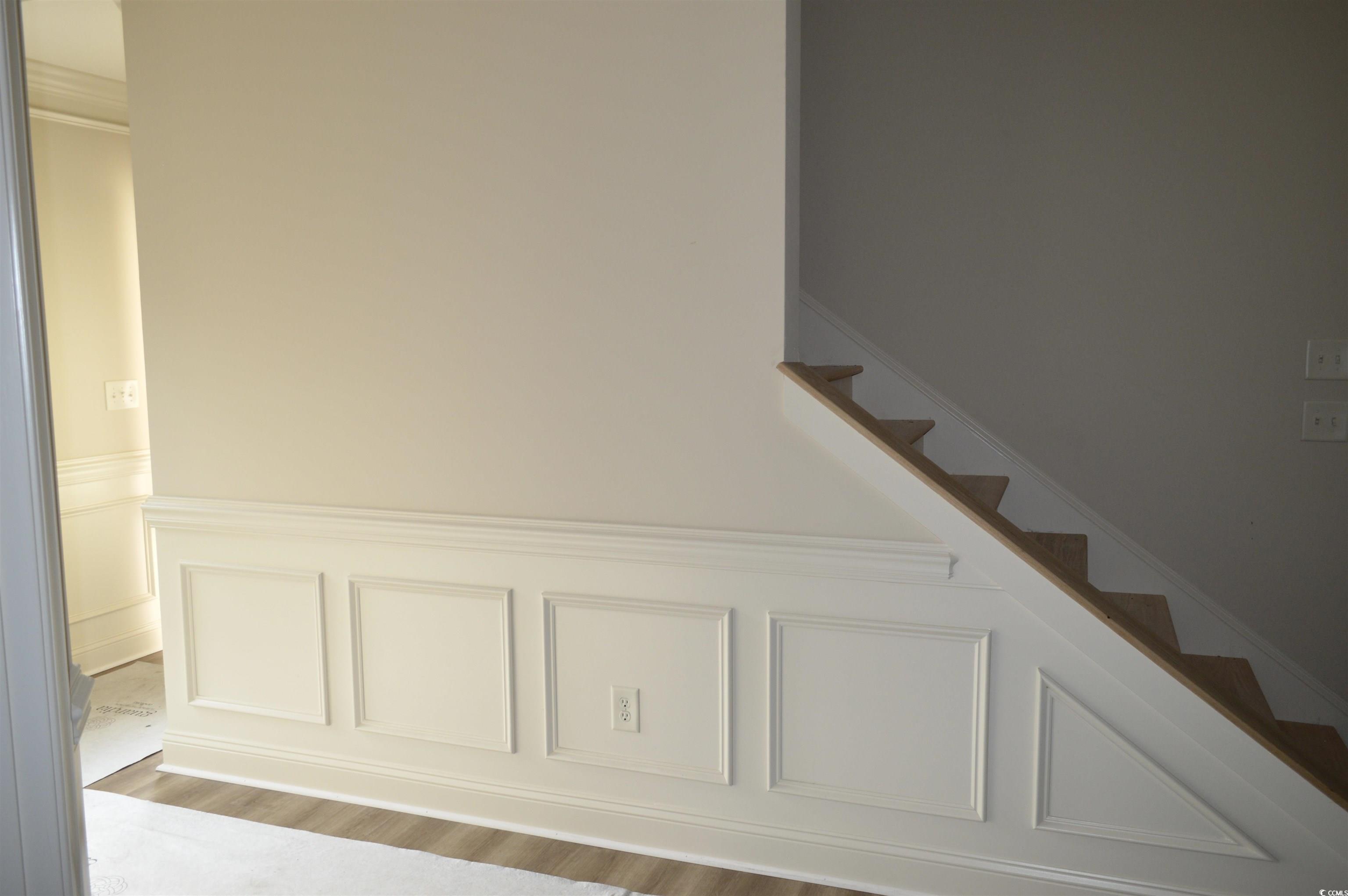110 Hallandale Lane, Unit LEFT Murrells Inlet, SC 29576 - Photo 6 of 27 Staircase with ornamental molding and hardwood / wood-style floors