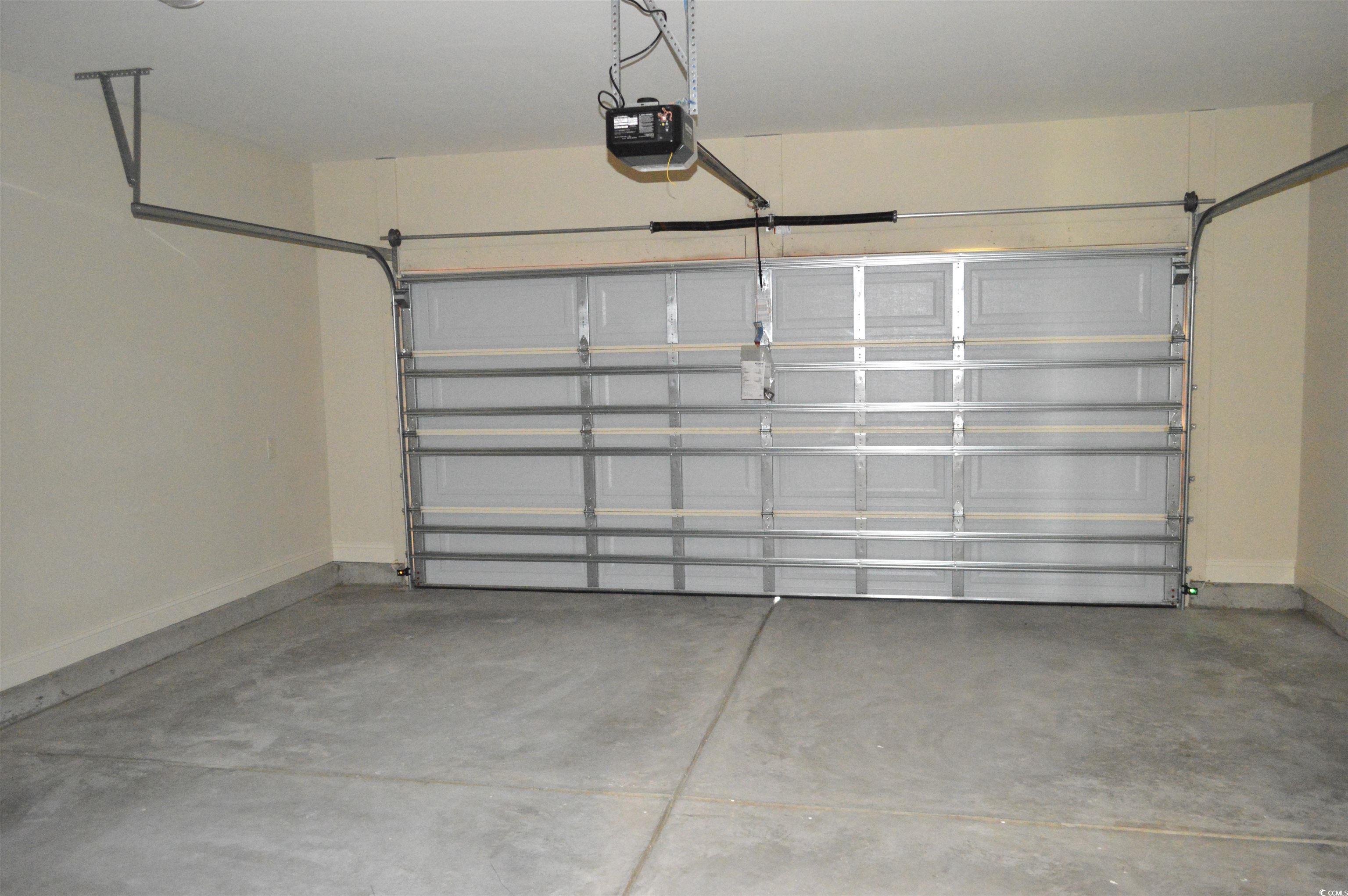 110 Hallandale Lane, Unit LEFT Murrells Inlet, SC 29576 - Photo 8 of 27 Garage with a garage door opener