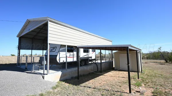 a patio with table and chairs