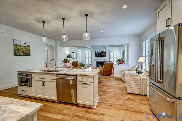 a kitchen with stainless steel appliances granite countertop a stove and a refrigerator