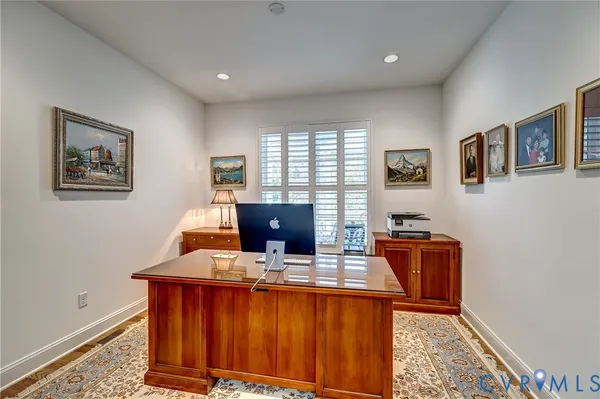 a workspace with furniture and window