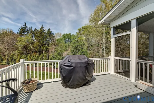 a view of a wooden deck with a bench