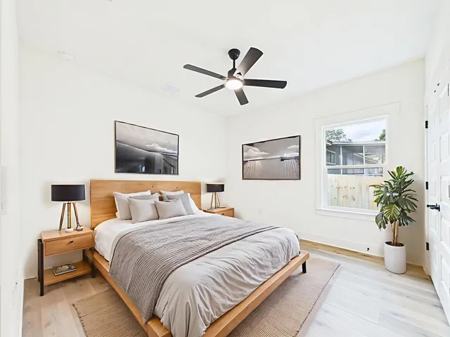a kitchen with a sink stainless steel appliances and chandelier
