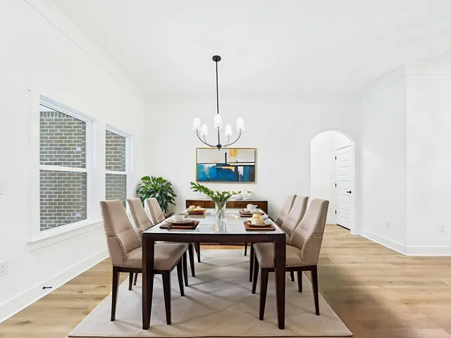 a view of a livingroom with a ceiling fan and window