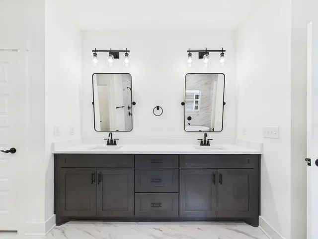 a bathroom with a bathtub and shower