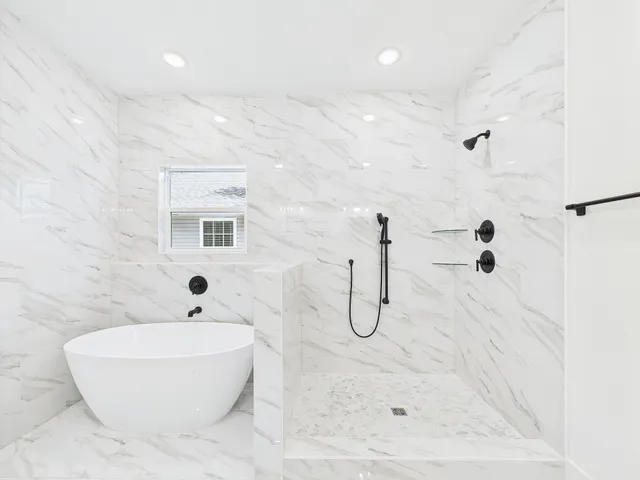a bathroom with a double vanity sink and mirror