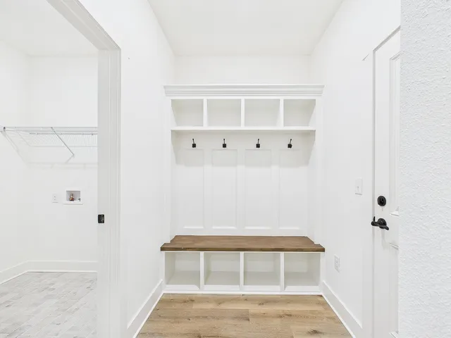 a kitchen with a sink a center island and cabinets