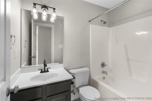 a bathroom with a sink toilet tub and shower