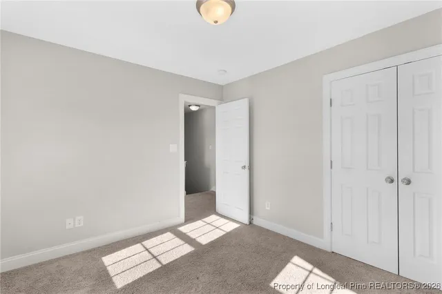 a view of livingroom with closet