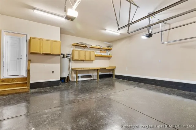 a view of work space with furniture and windows