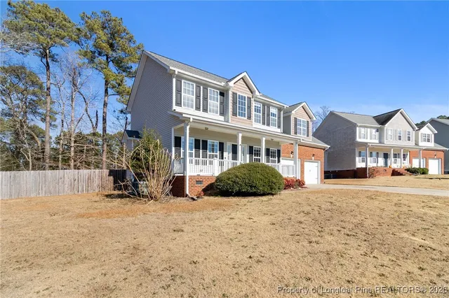 a view of a building with a yard