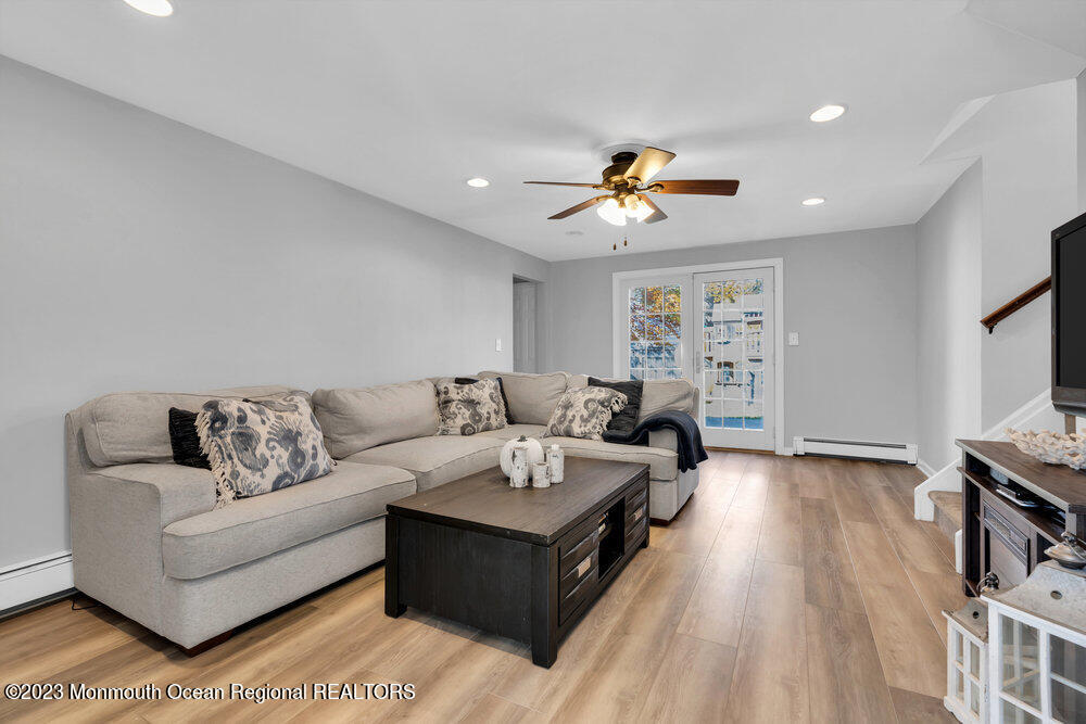 17 Eisele Avenue Asbury Park, NJ 07712 - Photo 12 of 52 a living room with furniture and a flat screen tv
