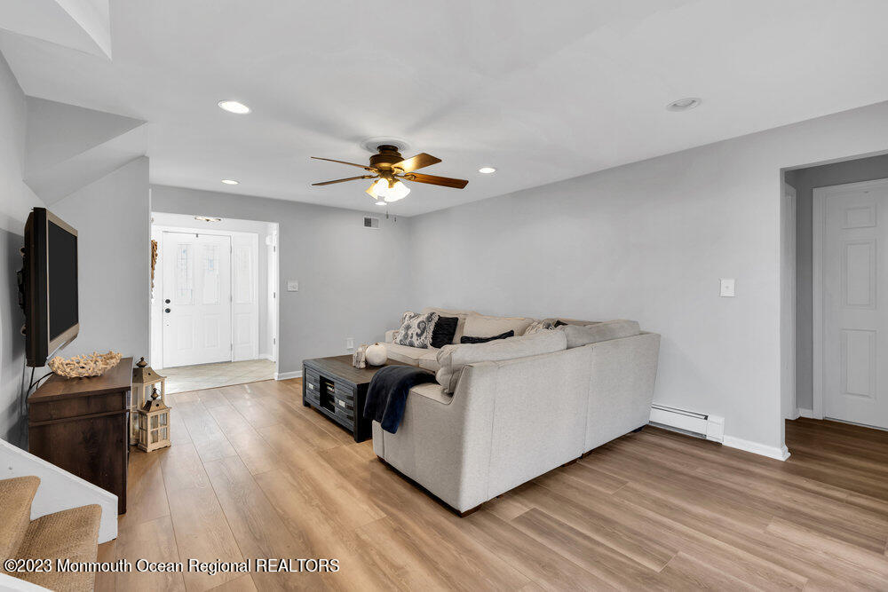 17 Eisele Avenue Asbury Park, NJ 07712 - Photo 15 of 52 a living room with furniture and a flat screen tv