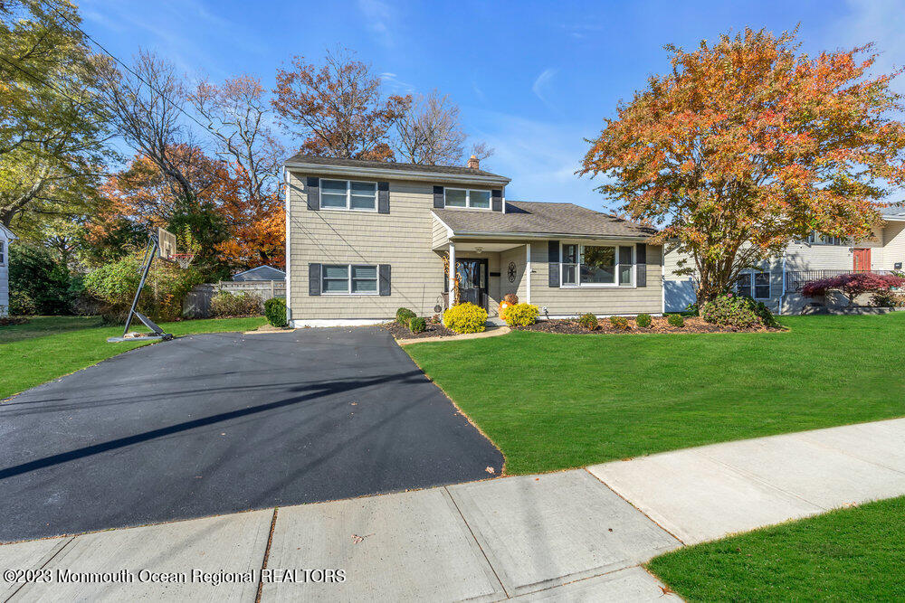 17 Eisele Avenue Asbury Park, NJ 07712 - Photo 2 of 52 a front view of a house with a yard table and chairs