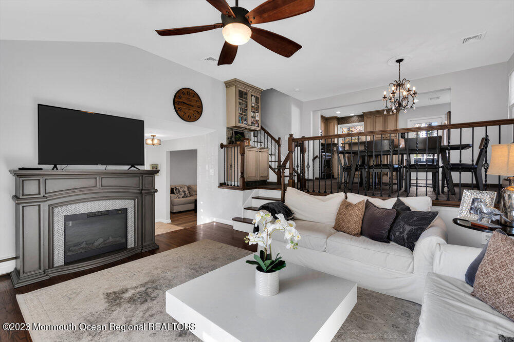 17 Eisele Avenue Asbury Park, NJ 07712 - Photo 25 of 52 a living room with furniture a fireplace and a flat screen tv