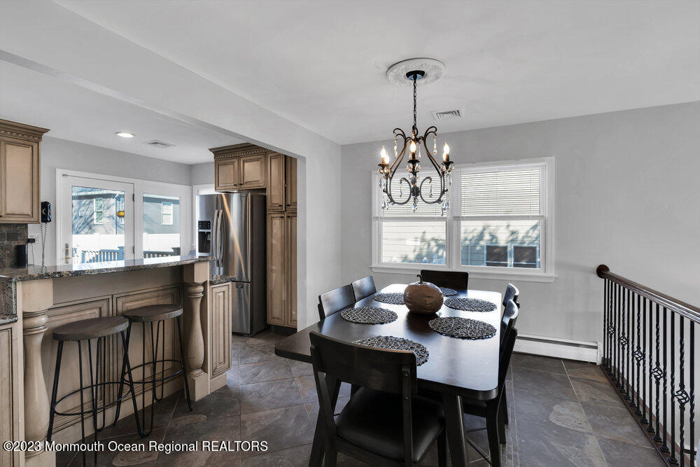 17 Eisele Avenue Asbury Park, NJ 07712 - Photo 28 of 52 a dining room with furniture a chandelier and window