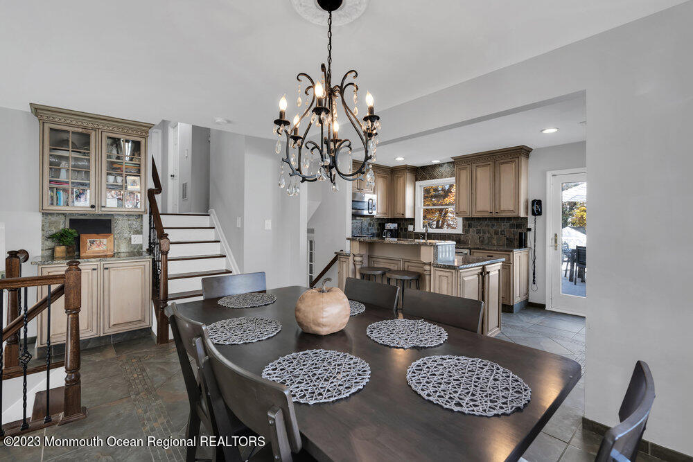 17 Eisele Avenue Asbury Park, NJ 07712 - Photo 31 of 52 a kitchen with a table and chairs in it