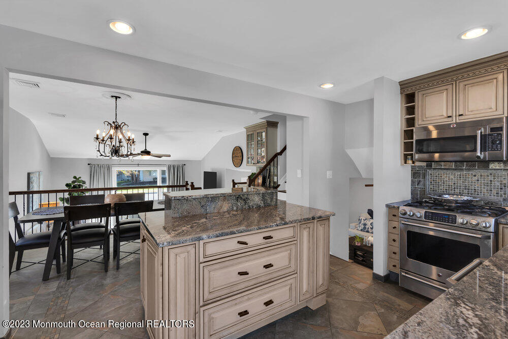 17 Eisele Avenue Asbury Park, NJ 07712 - Photo 36 of 52 a kitchen with stainless steel appliances granite countertop a stove and a sink