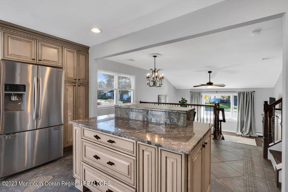 17 Eisele Avenue Asbury Park, NJ 07712 - Photo 37 of 52 a kitchen with stainless steel appliances granite countertop a refrigerator and a sink