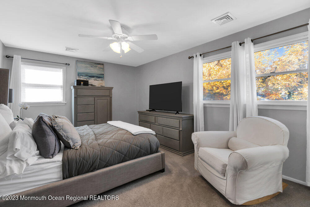 17 Eisele Avenue Asbury Park, NJ 07712 - Photo 42 of 52 a bedroom with a bed couch and window