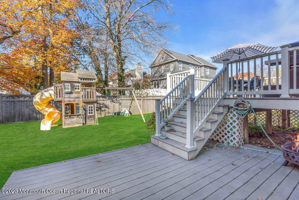 17 Eisele Avenue Asbury Park, NJ 07712 - Photo 46 of 52 a view of a chair and table on the wooden deck