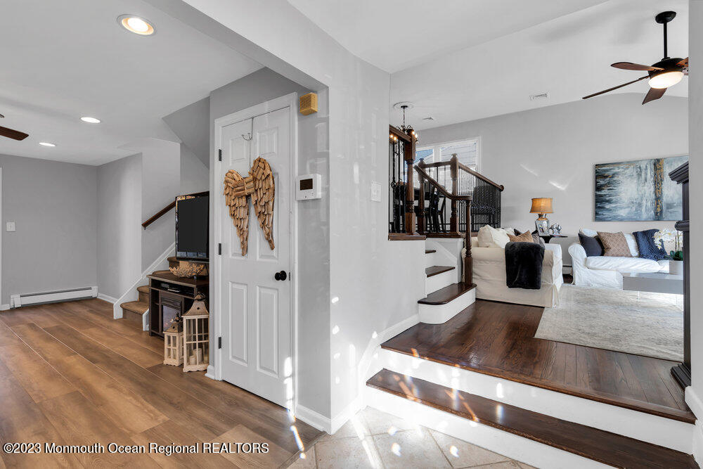 17 Eisele Avenue Asbury Park, NJ 07712 - Photo 9 of 52 a living room with furniture and a flat screen tv