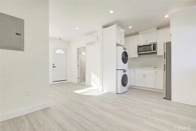 a view of kitchen with wooden floor