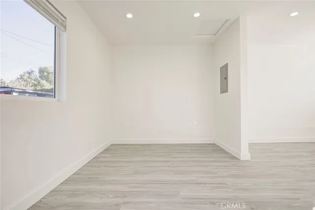 a view of room with wooden floor