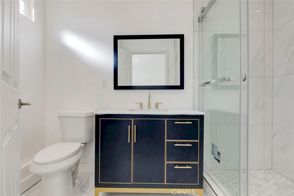 7846 Kyle Street Sunland, CA 91040 - Photo 10 of 12 a bathroom with a sink and a toilet