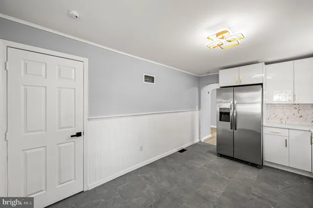 a kitchen with cabinets and stainless steel appliances