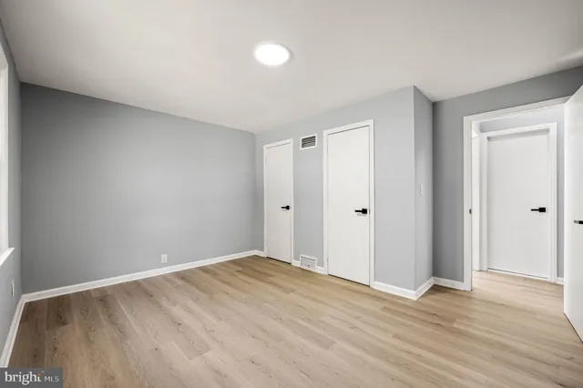 a view of room with wooden floor