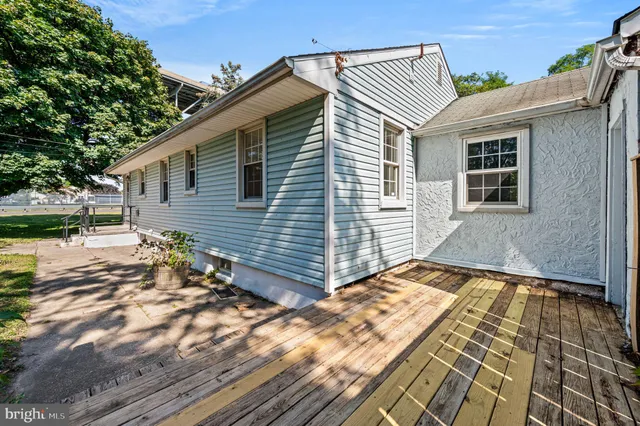 a view of backyard with a patio
