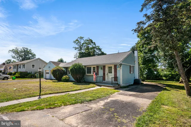 a view of a house with yard and a garden