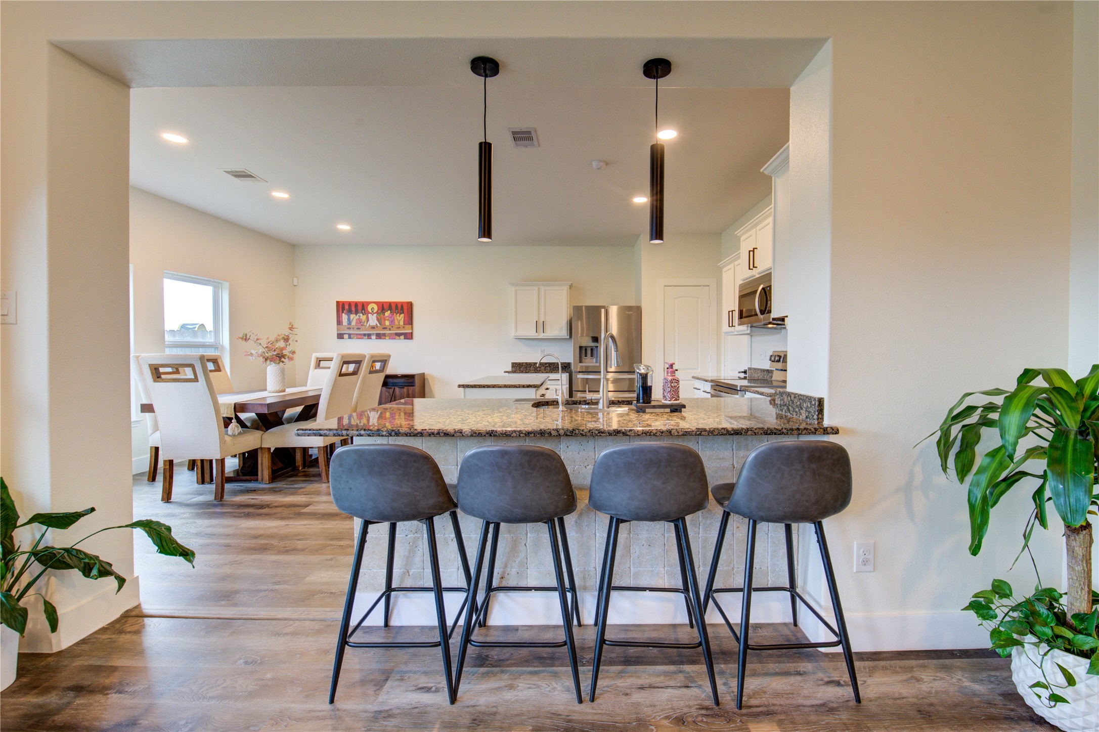 2003 Beach Bluff Road Rosenberg, TX 77469 - Photo 20 of 50 a kitchen with granite countertop a counter space a sink and living room view