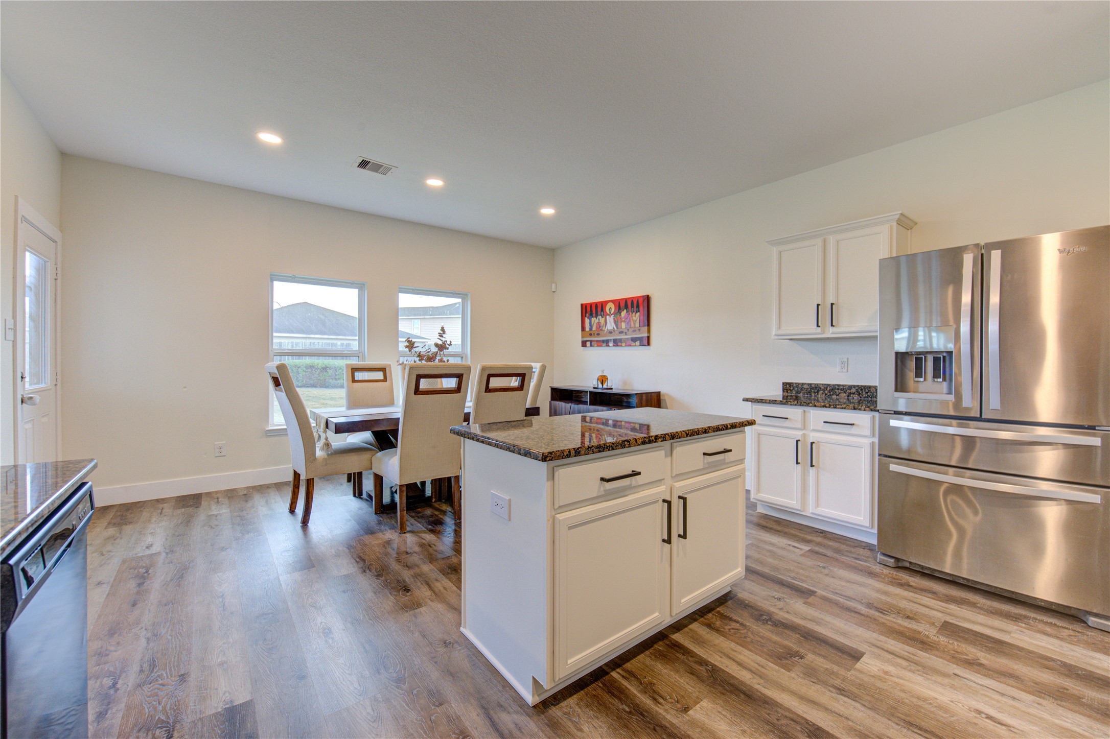 2003 Beach Bluff Road Rosenberg, TX 77469 - Photo 22 of 50 a kitchen with a stove a sink dishwasher a refrigerator and wooden floor