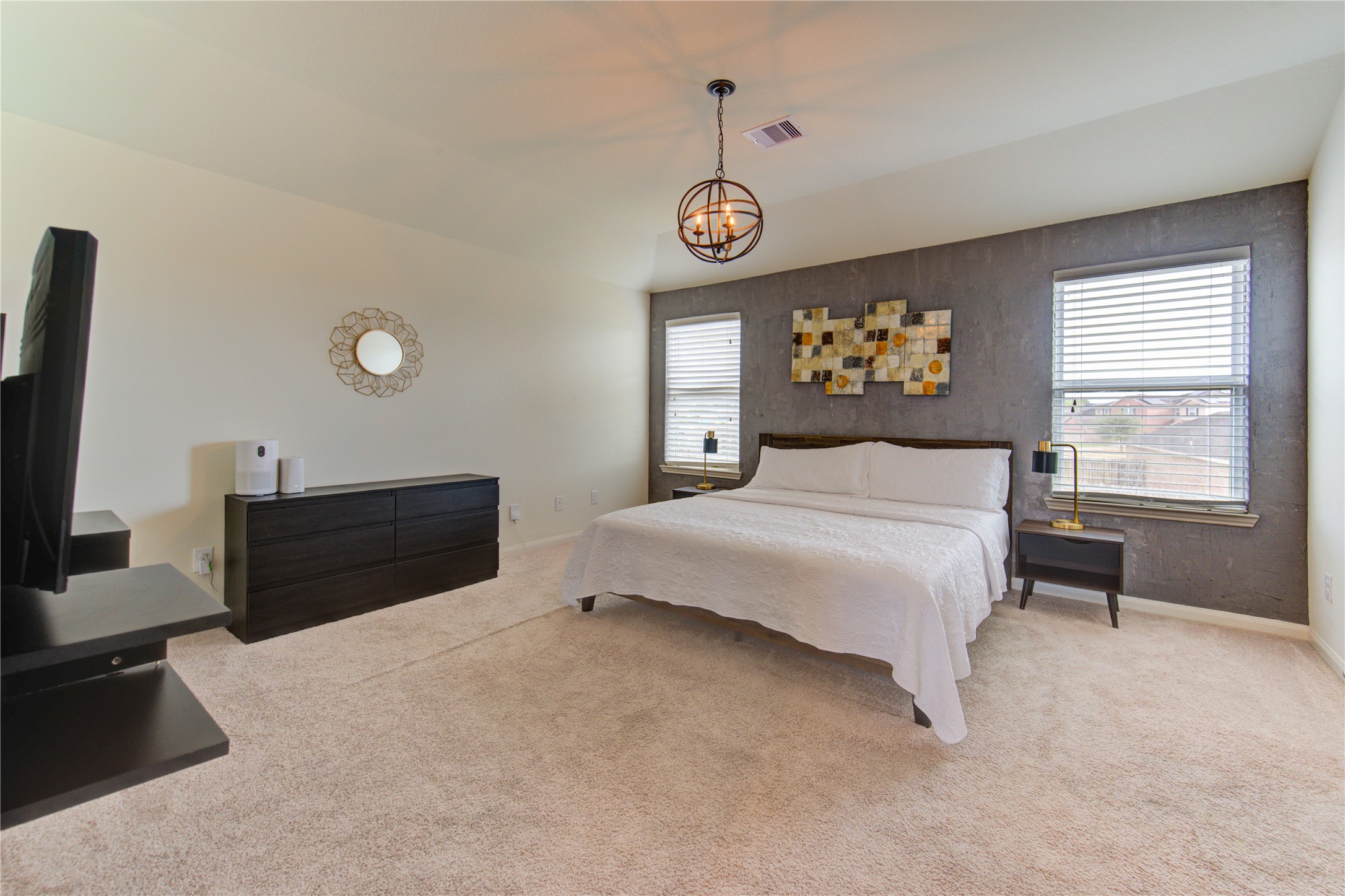 2003 Beach Bluff Road Rosenberg, TX 77469 - Photo 34 of 50 a spacious bedroom with a bed and a large window