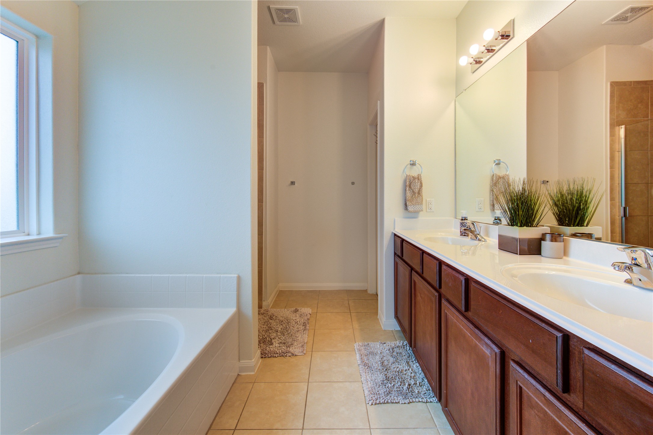 2003 Beach Bluff Road Rosenberg, TX 77469 - Photo 39 of 50 a bathroom with a tub sink and mirror