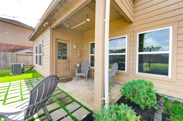 a house view with a seating space and garden view