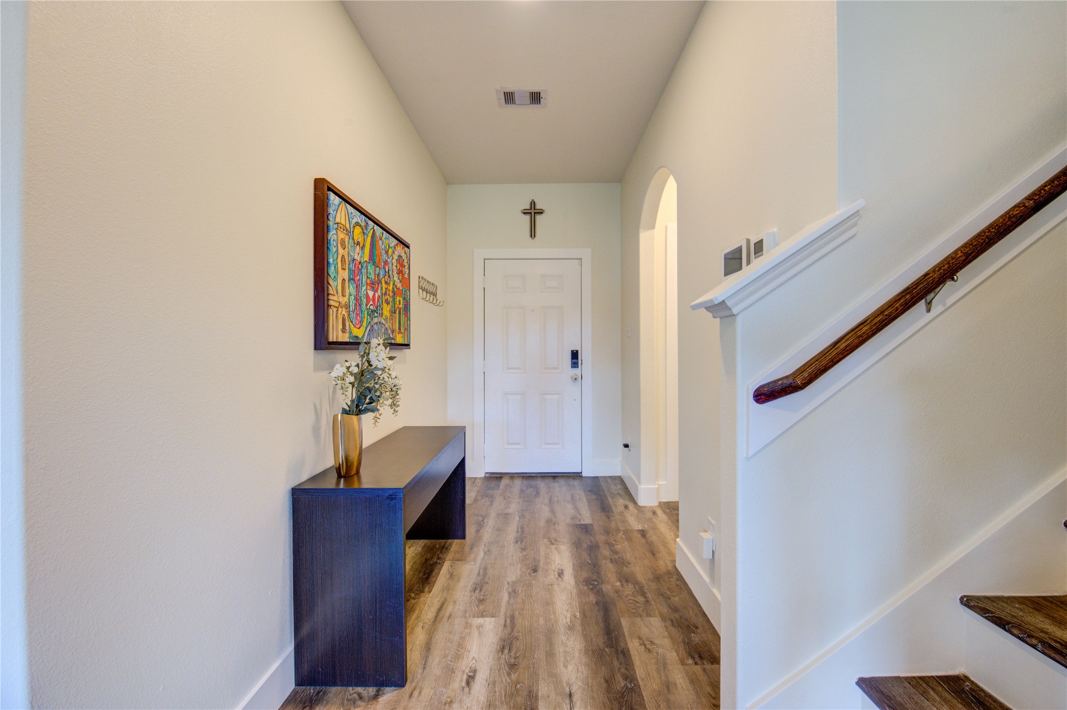 2003 Beach Bluff Road Rosenberg, TX 77469 - Photo 10 of 50 a view of a hallway with wooden floor and staircase