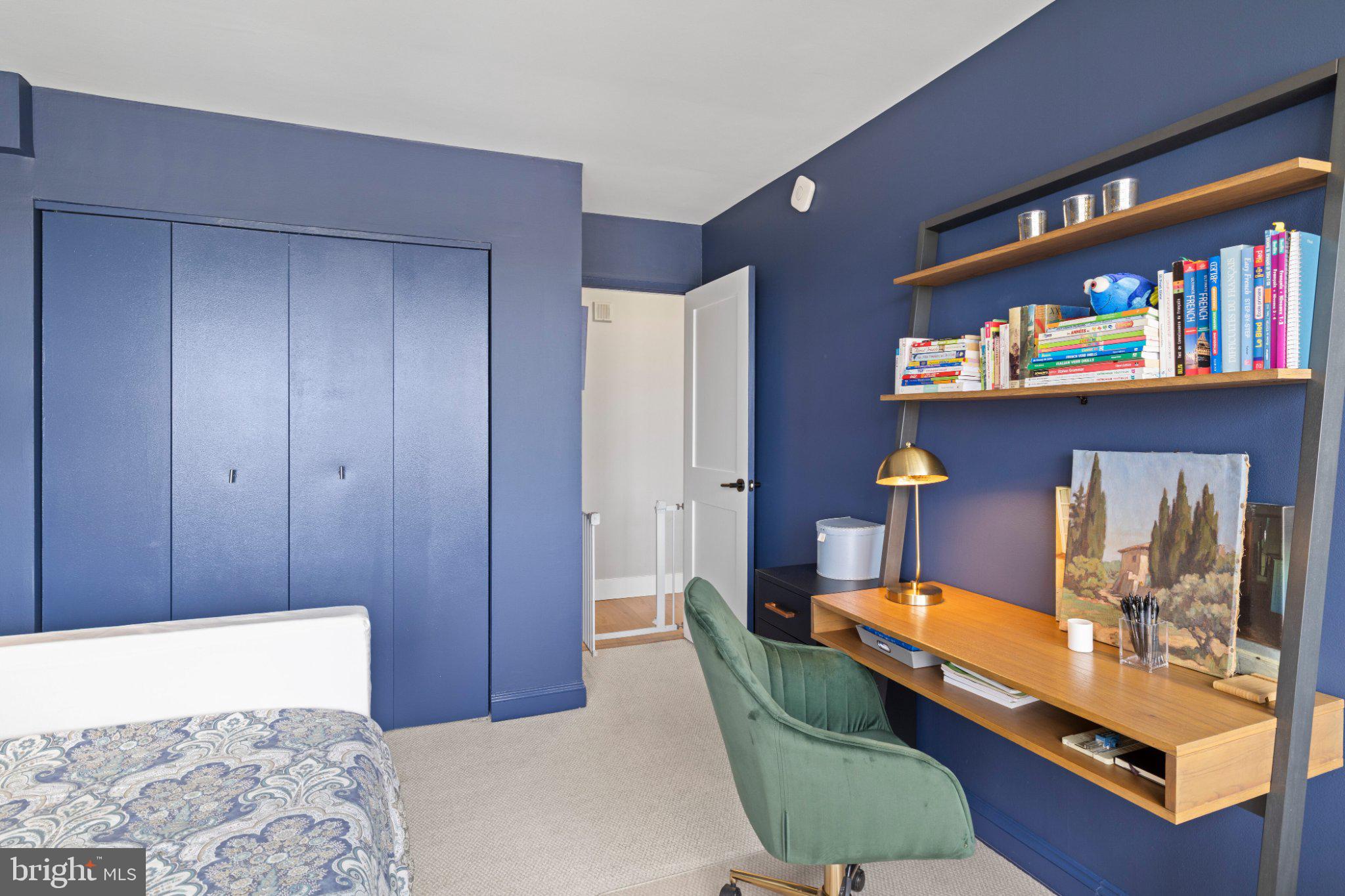 2001 Hamilton Street, Unit 1119 Philadelphia, PA 19130 - Photo 25 of 44 Chic workspace in a serene blue room.