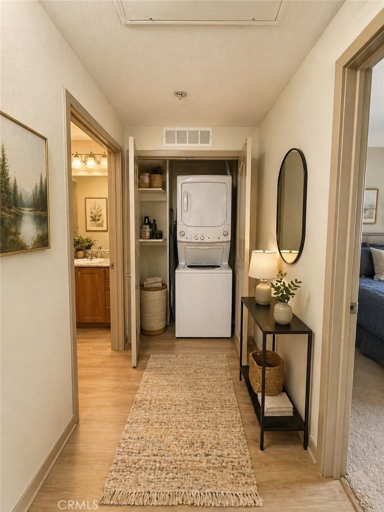 203 North San Dimas Canyon Road San Dimas, CA 91773 - Photo 6 of 11 a view of a hallway with wooden floor and a bathroom