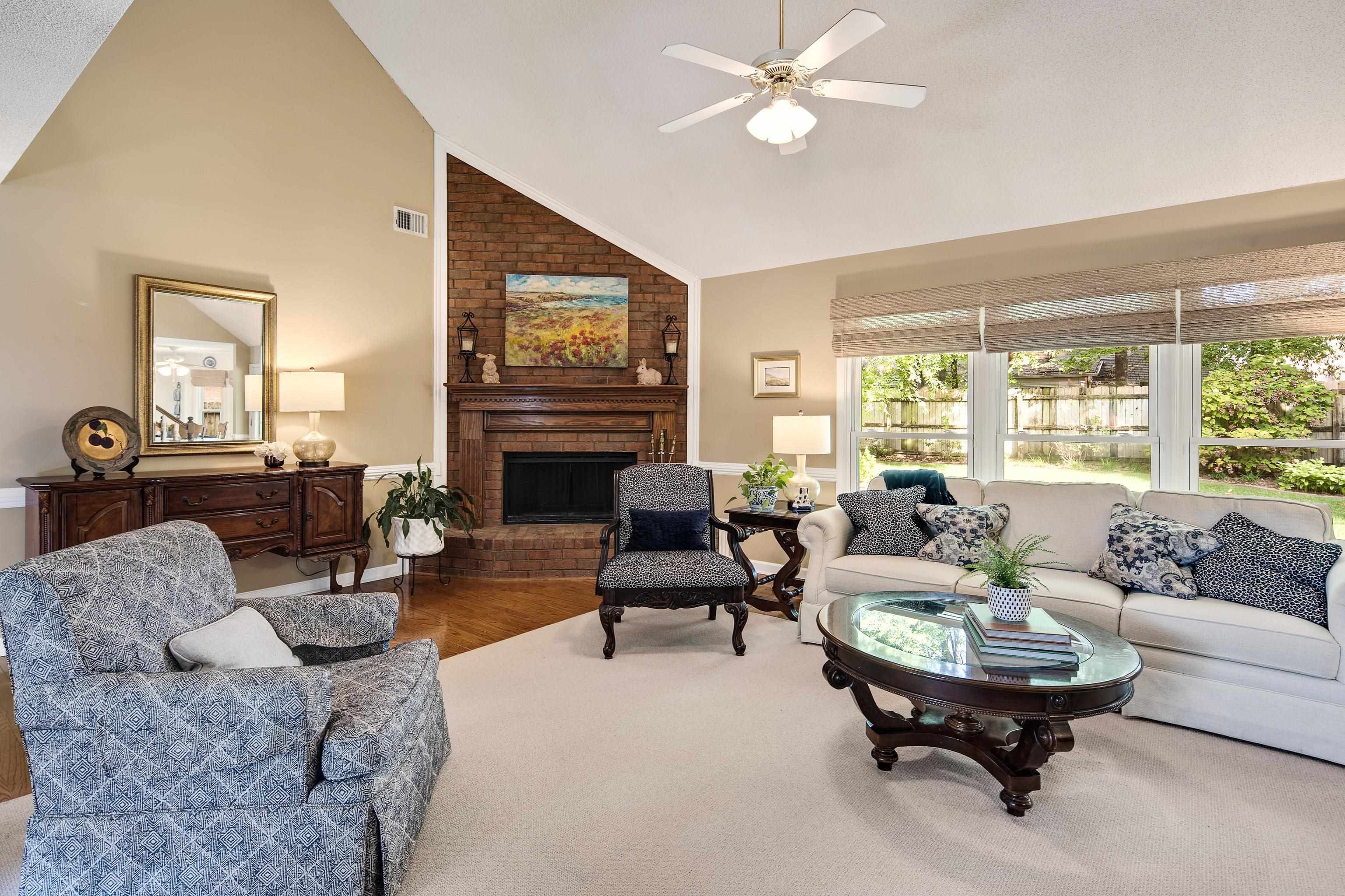 1524 Dexter Run Circle East Memphis, TN 38016 - Photo 11 of 35 Living room with high vaulted ceiling, a fireplace, ceiling fan, and hardwood / wood-style floors