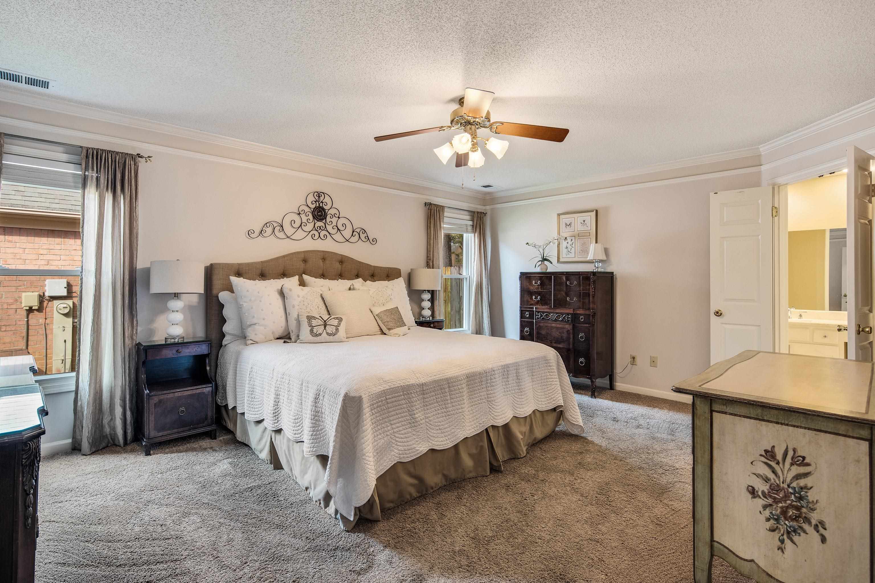 1524 Dexter Run Circle East Memphis, TN 38016 - Photo 20 of 35 Carpeted bedroom with ensuite bathroom, crown molding, ceiling fan, and a textured ceiling
