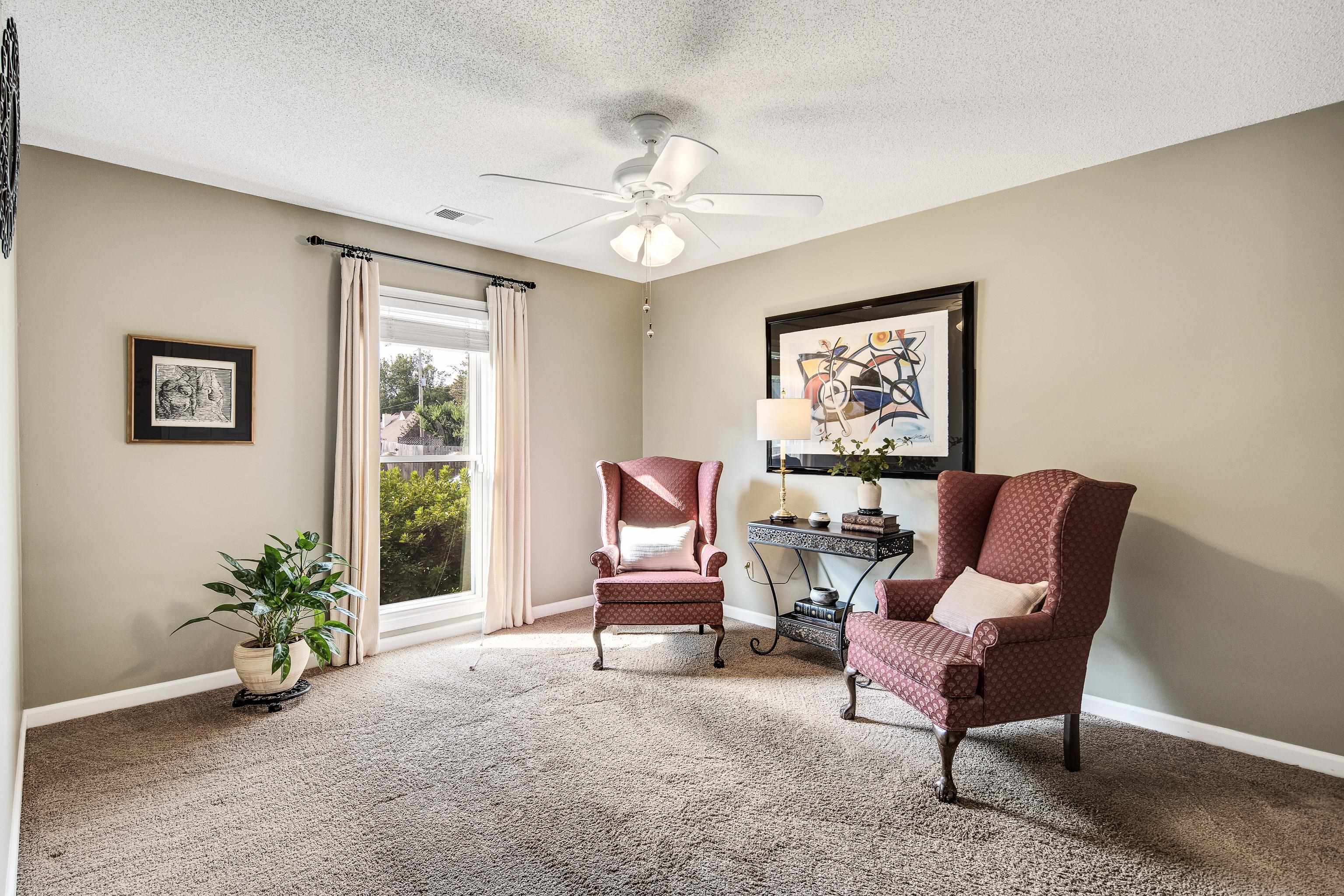 1524 Dexter Run Circle East Memphis, TN 38016 - Photo 24 of 35 Living area featuring carpet, a textured ceiling, and ceiling fan