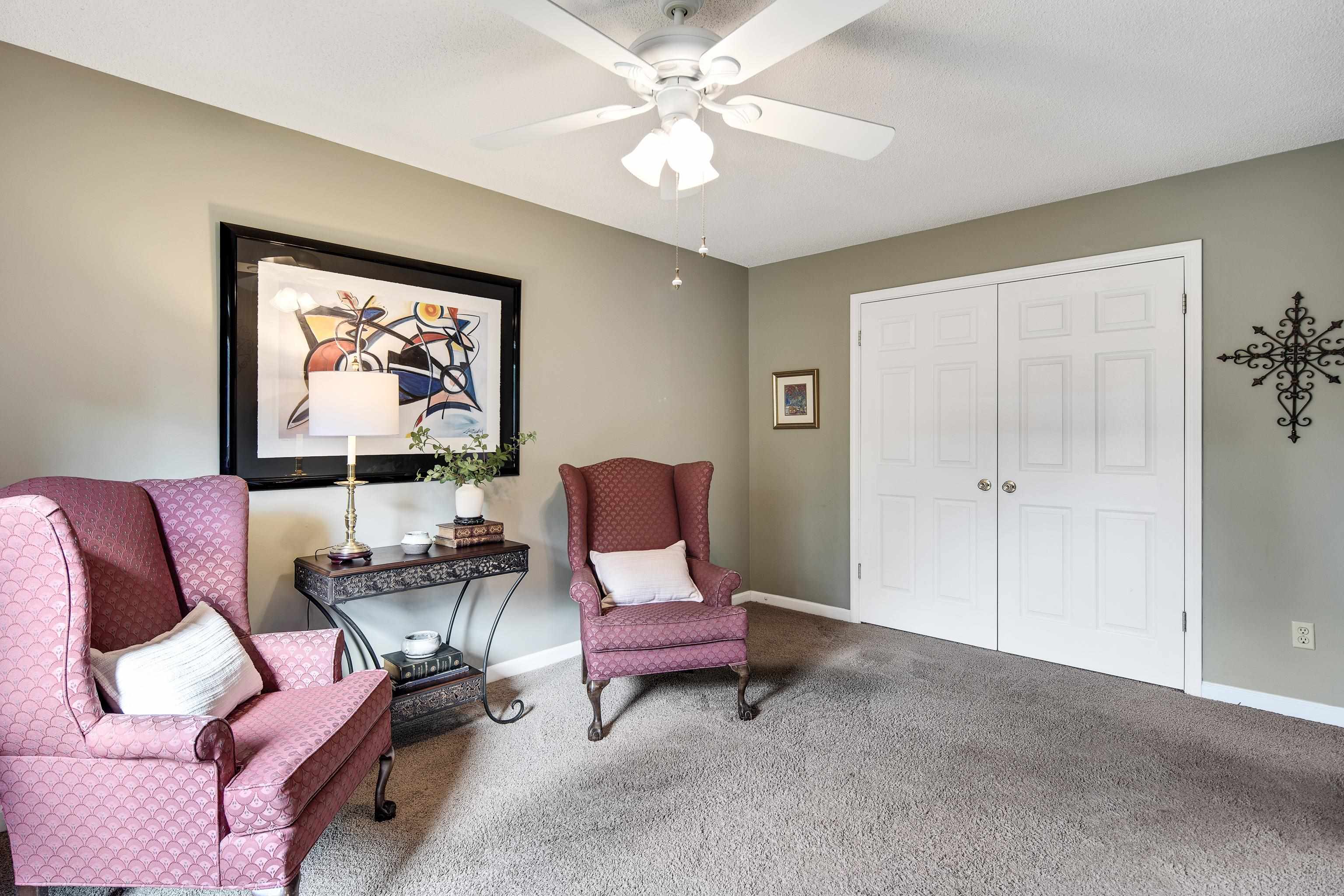 1524 Dexter Run Circle East Memphis, TN 38016 - Photo 25 of 35 Living area with carpet and ceiling fan