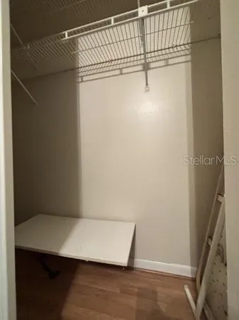 a bathroom with a granite countertop sink toilet a mirror and shower