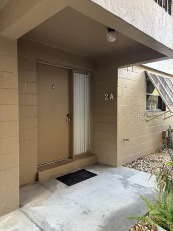 a view of a wooden door of a house
