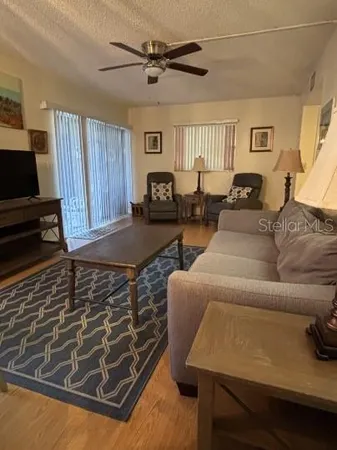a view of a hallway to rooms and bathroom