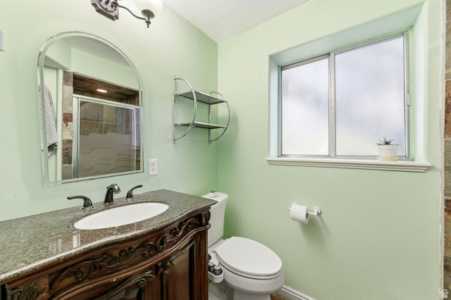 2632 North 140 West Sunset, UT 84015 - Photo 9 of 12 Bathroom with vanity and a shower stall